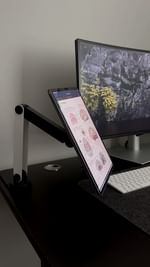 Instagram post by @urgenatomy for FansDreams. Caption reads: Elevating my desk setup with @fansdreams_official....