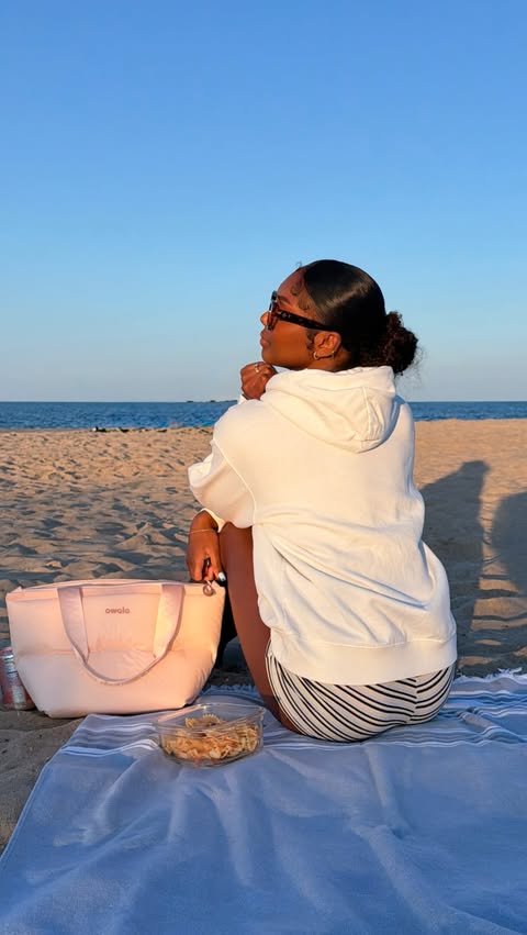 Instagram post by @_thtblasiangirl for Owala. Caption reads: [...] the beach >>> I love using my @Owala Puffer....