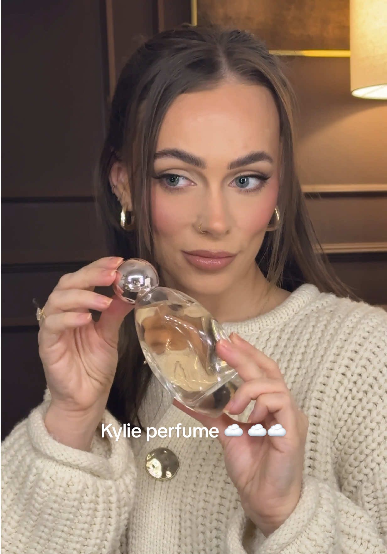 TikTok post by @amynicolemakeup for Kylie Cosmetics. Caption reads: [...] by Kylie hits the spot ☁️👼🏼🤍 @Kylie....