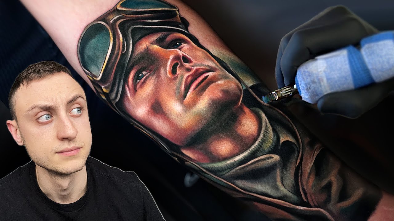 YouTube post by @joshwilliamstattoo for Dragonhawk Official. Caption reads: Tattooing a WW Pilot 2 Days in a row | Starting a....