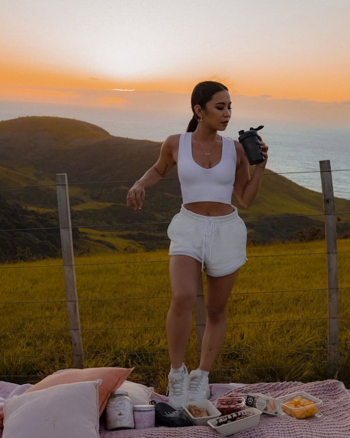 Instagram post by @_jjanelle__ for LUXE Fitness. Caption reads: Chasing sunsets with @luxefitness 🙈 
Got my Fit....