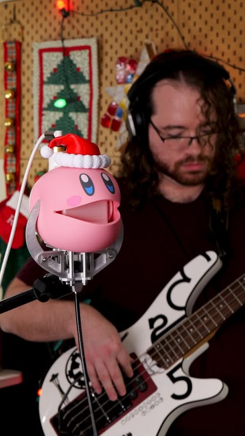 Instagram post by @moshibass for PCBWay. Caption reads: I turned an Otamatone head into a guitar....