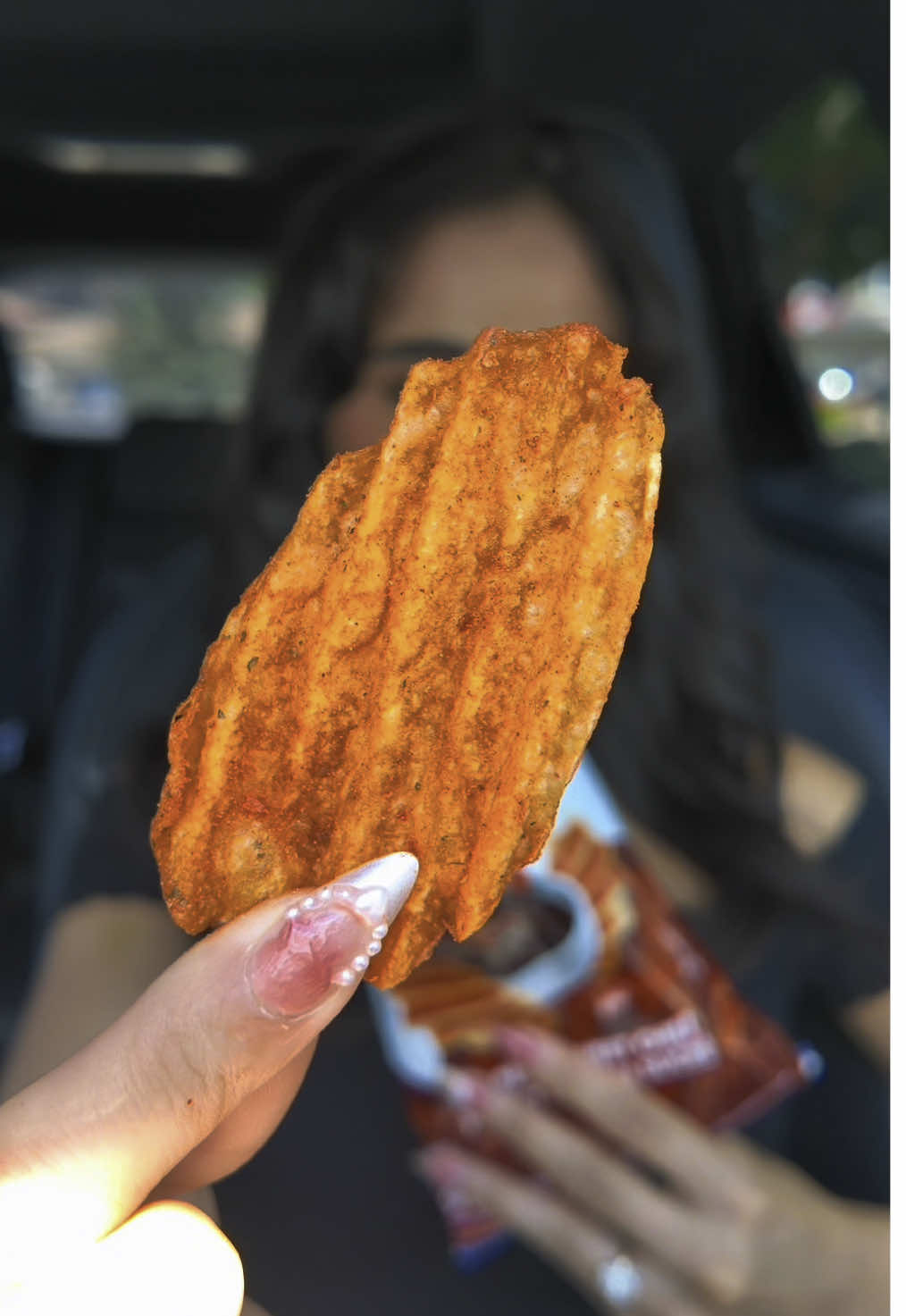 TikTok post by @tasmindhaliwal for Ruffles. Caption reads: [...] Huge. Massive. I AM A CHIP LICKER. And....