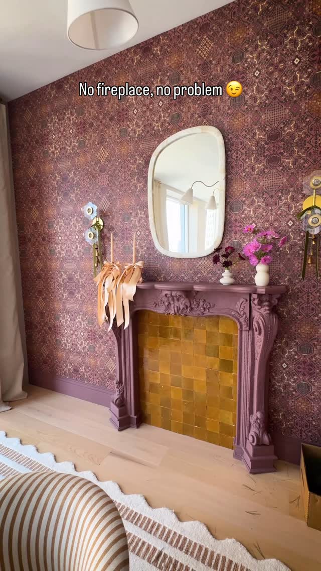 Instagram post by @alexandragater for Real Simple. Caption reads: Dreaming of a cozy evening by this faux fireplace…....