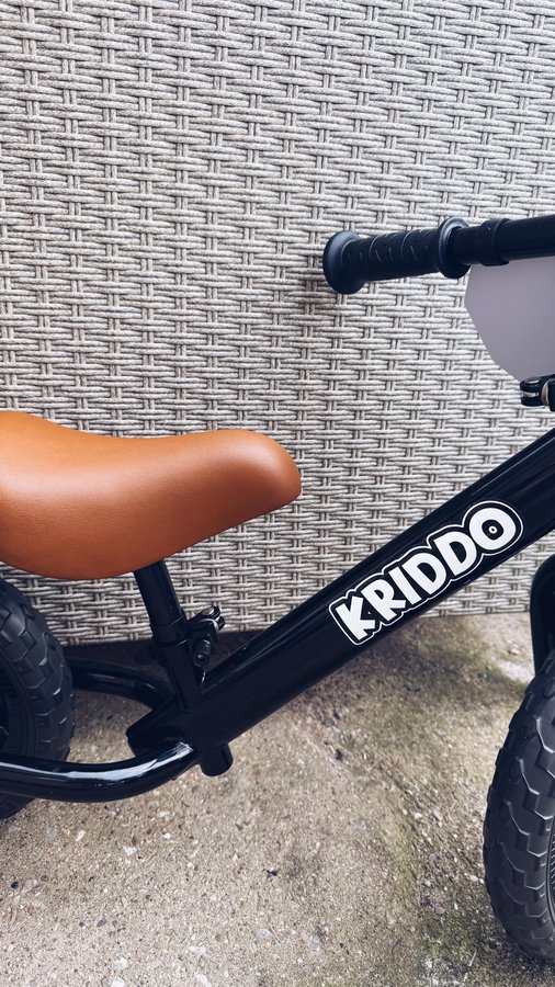 Instagram post by @raising_ajs for KRIDDO. Caption reads: Introducing the @kriddo_us Toddler Balance Bike!....