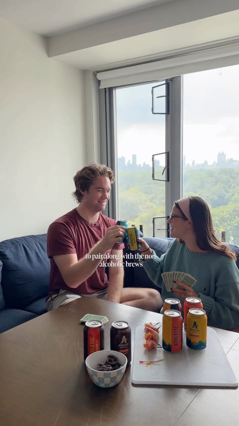 Instagram post by @uncorked.elle for Athletic Brewing Co. Caption reads: 🥨Brews & bites pairings #sponsored by....