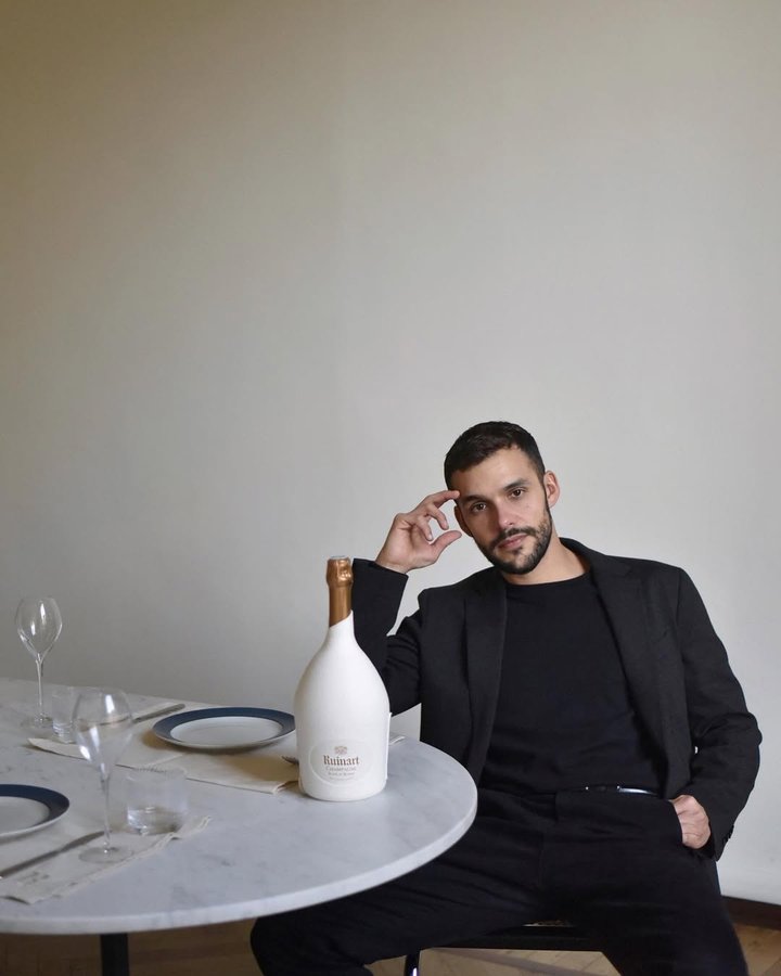 Instagram post by @ulmn for Champagne Ruinart. Caption reads: Let's celebrate the holiday season with those we....