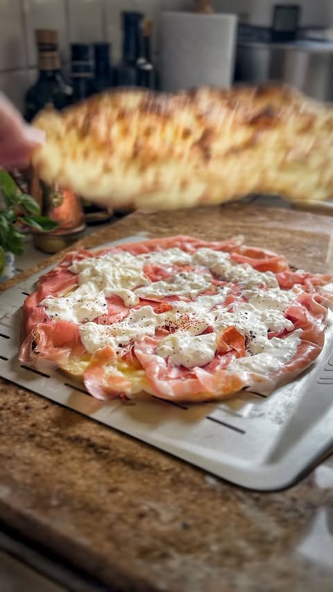 Instagram post by @dough_and_behold for Ooni. Caption reads: 🥪🍕🥪

Today’s #sundaysarnie is an oldie but a....