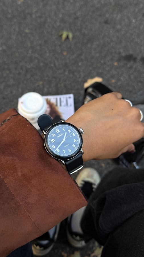Instagram post by @kanchanalle for Shinola. Caption reads: #ad | @shinola built my fall look around the....