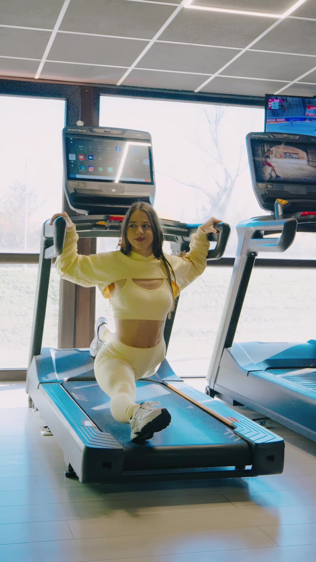 TikTok post by @lucia.mikusova for Gym Glamour. Caption reads: The only way to get off the treadmill 😁💛 wearing....