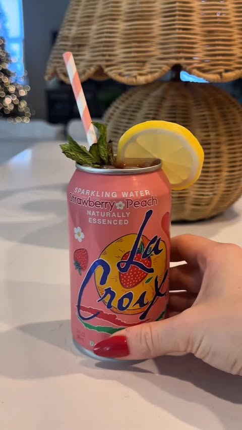 Instagram post by @_yevaberez_ for LaCroix Water. Caption reads: Decorating my @lacroixwater Christmas Tree🤭💗🎄✨....