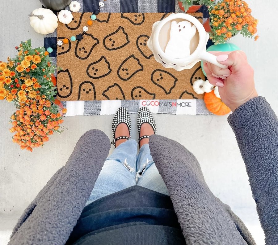Instagram post by @chrissyandcrew for CocoMatsNMore. Caption reads: The perfect spooky season mat from @cocomatsnmore....