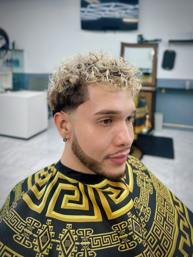 Instagram post by @walterjalvarez for Booksy. Caption reads: #collab / A barber’s touch is the ultimate form of....