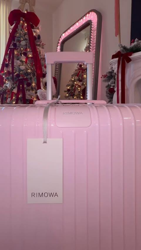 Instagram post by @misslhommedieu for RIMOWA. Caption reads: Christmas came early 🎀 I finally got my hands on....
