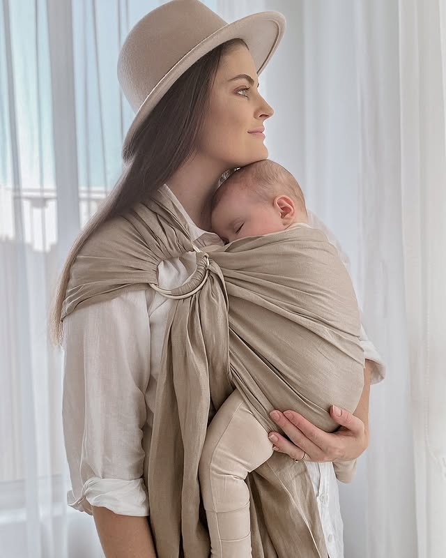 Instagram post by @raisinglionhearts for WildBird. Caption reads: [...] This beautiful linen sling is from @wildbird....