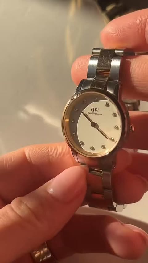 Instagram post by @alexandra_petram for Daniel Wellington. Caption reads: [...] - 20% 📌SANTADW1 code @DanielWellington....