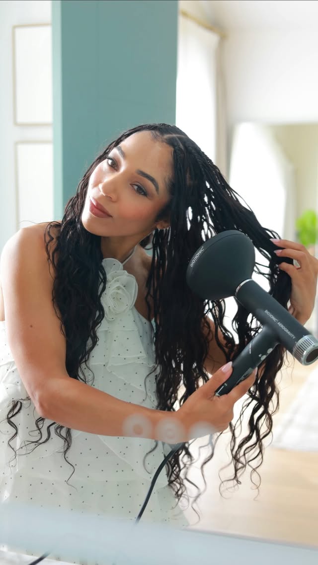 Instagram post by @aminamarie for Bio Ionic. Caption reads: [...] & easiest blowdryer to pack along from....