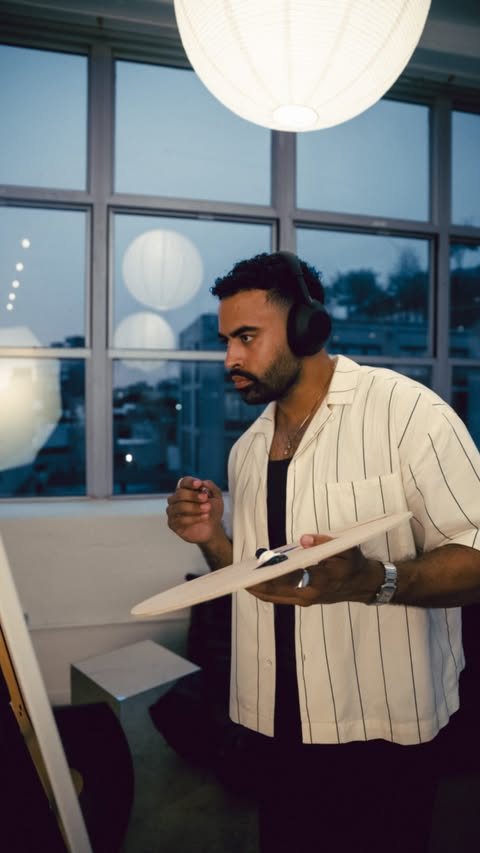 Instagram post by @justinglaze for Sony Electronics. Caption reads: [...] 🤝🏽 Paint Day 🏈🎨 locked in with....