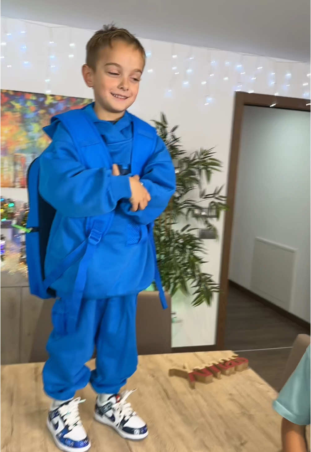 TikTok post by @mikeltubetv for Kith. Caption reads: Regalo Sorpresa @Kith 🎄🎅🧑‍🎄.