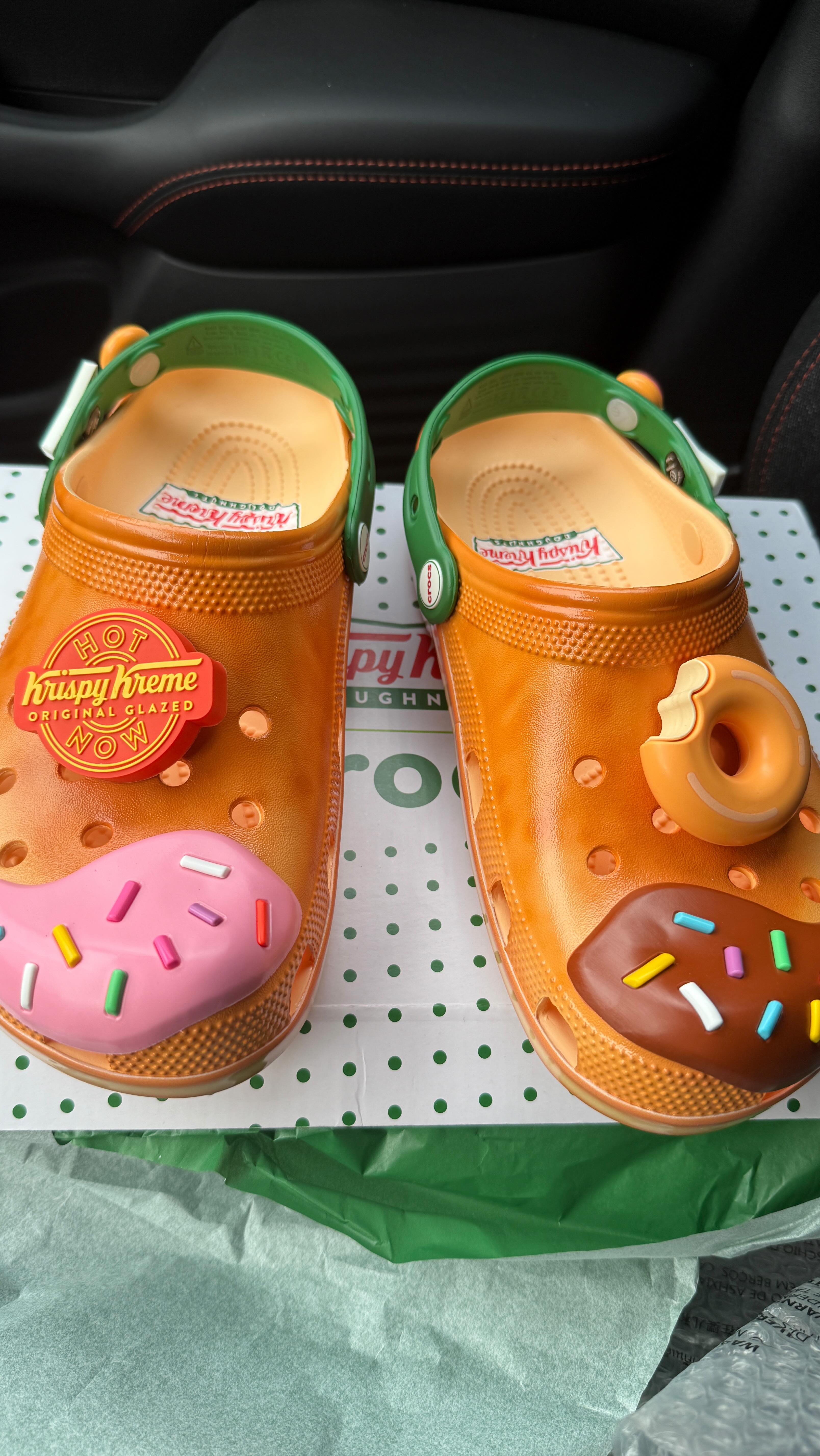 Instagram post by @markie_devo for Krispy Kreme. Caption reads: Krispy Kreme X Crocs!!

📲Get these now at....