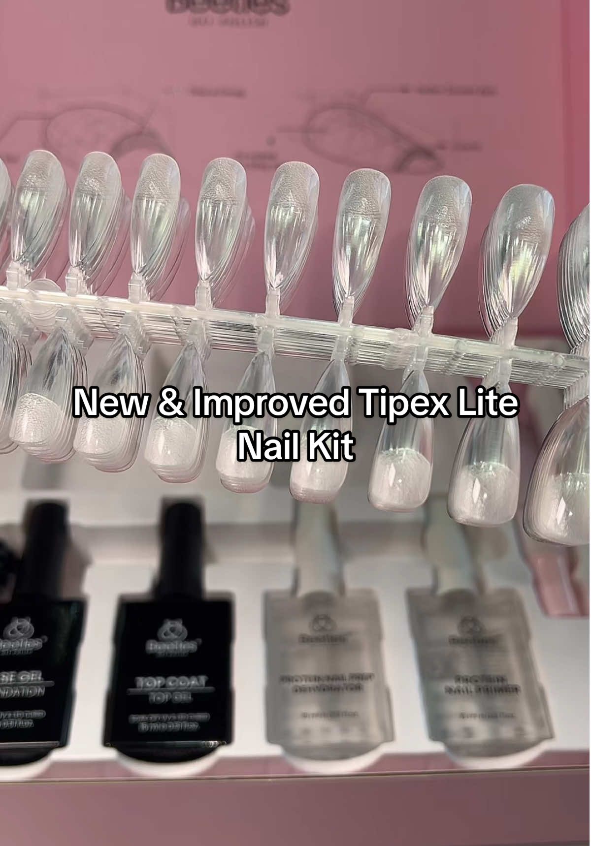 TikTok post by @real.natalia for BeetlesGelPolish. Caption reads: [...] Tipex nails from @BeetlesGelPolish bigger....