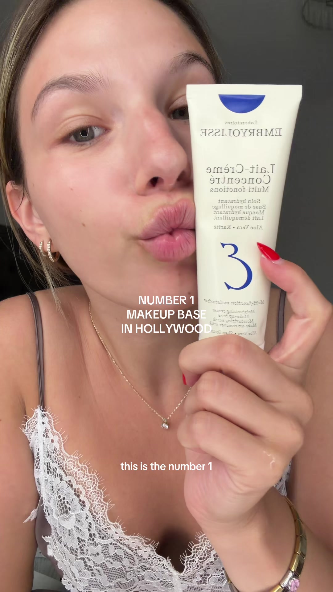 TikTok post by @selina.sherman for Embryolisse USA. Caption reads: @Embryolisse giving my face the glowiest base ✨ My....