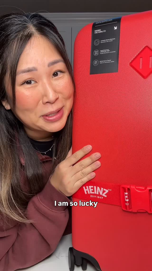 Instagram post by @katchaomeow for Heinz. Caption reads: this ketchup red luggage is GORGEOUS ❤️ Thank you....