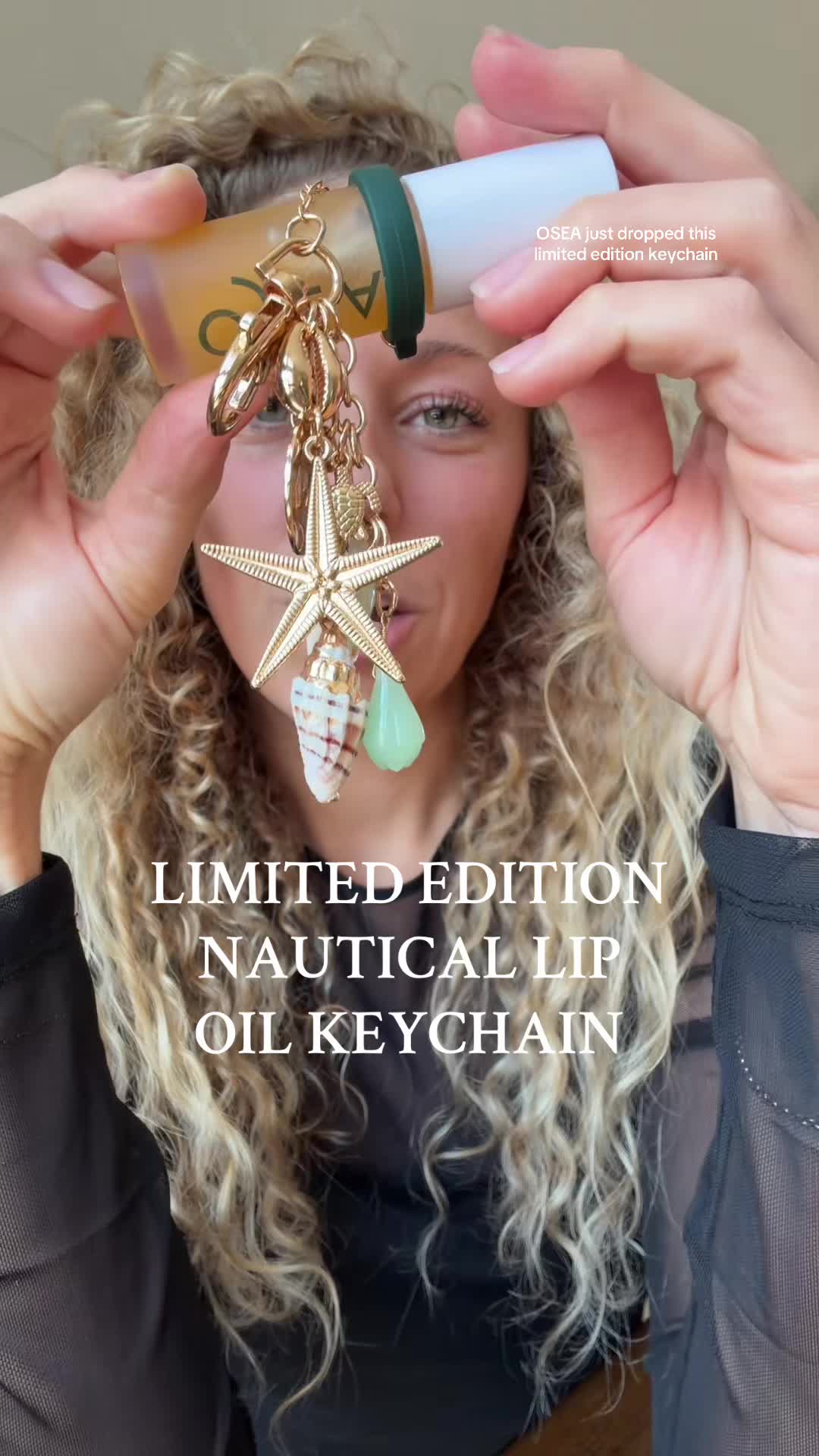 TikTok post by @healthywithlexie for OSEA Malibu. Caption reads: [...] stunning gold keychain from @OSEA Malibu....