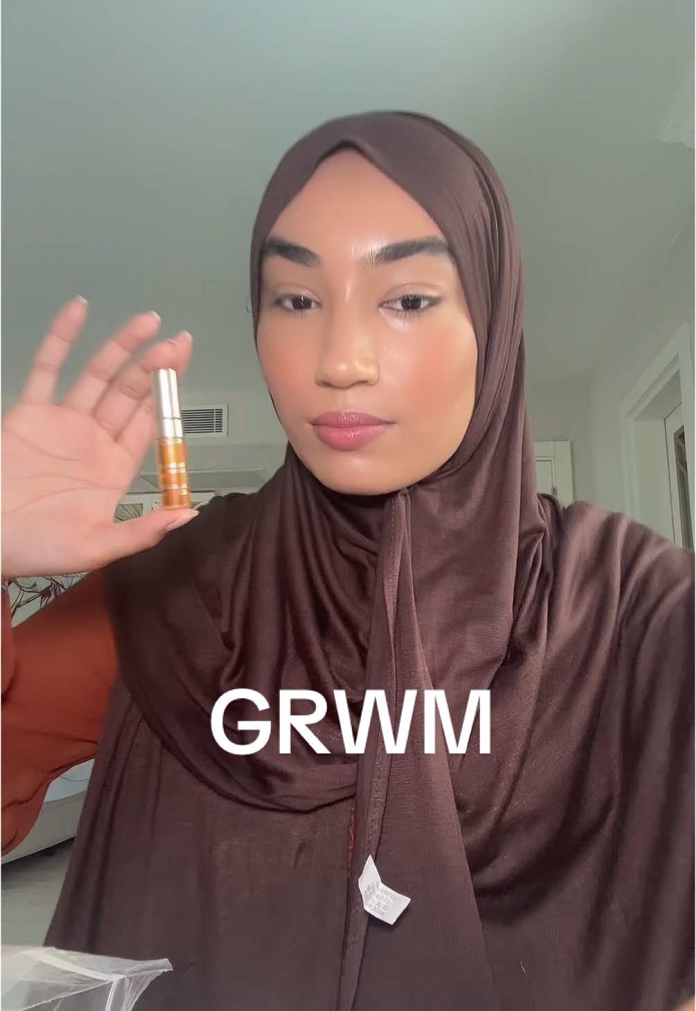 TikTok post by @mynameisrifah for IT Cosmetics. Caption reads: grwm with NO POWDER products 😫🙏🏼 #grwm #makeup....