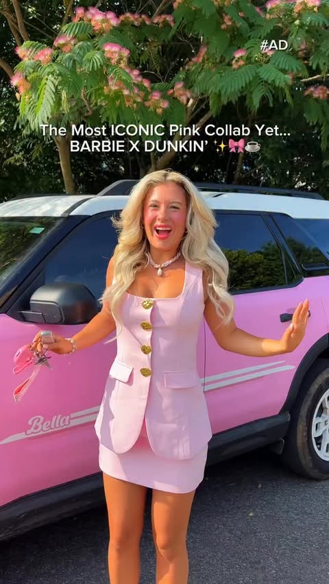 Instagram post by @bella_woodard for Barbie. Caption reads: [...] the new iconic collab from Dunkin’ X @barbie....
