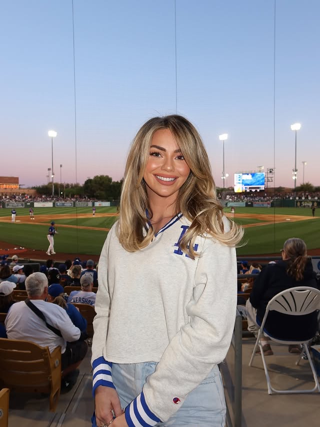 Instagram post by @chelseafreeman5 for Champion. Caption reads: [...] getting ready for opening day! Wearing....
