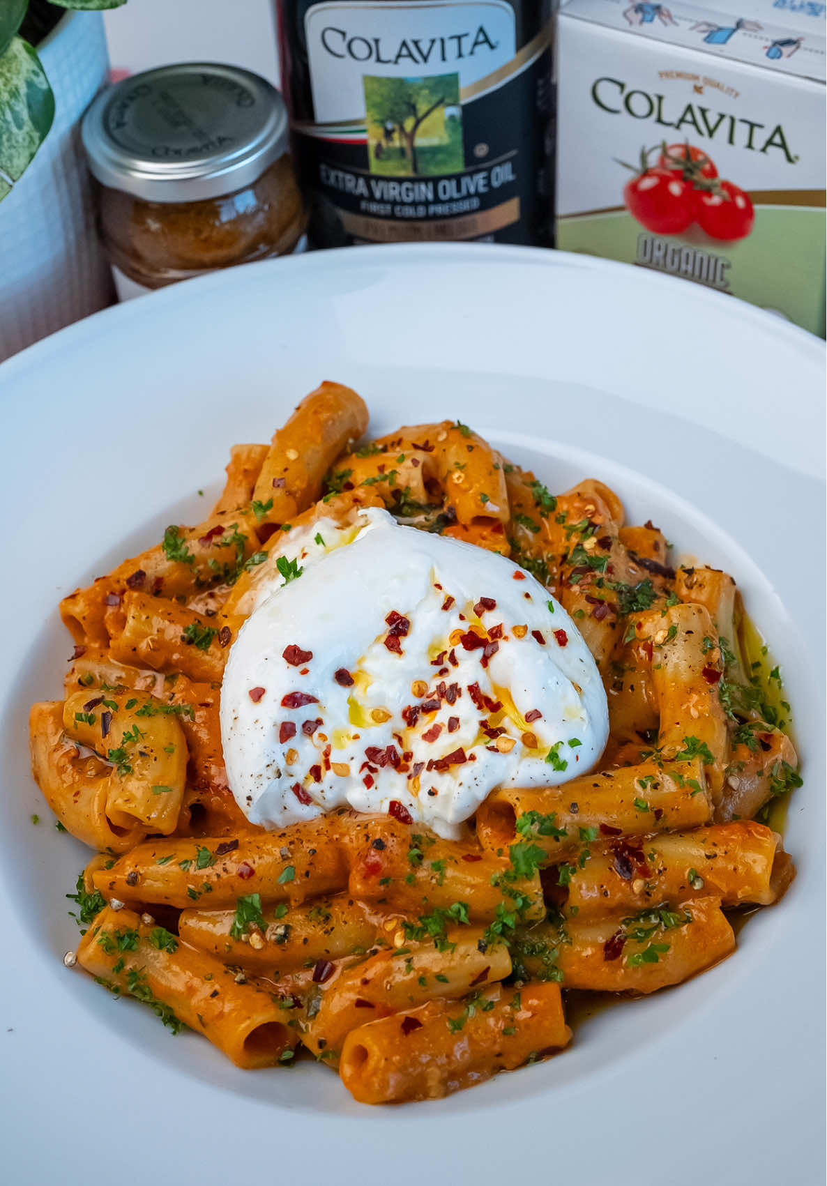 TikTok post by @breadbakebeyond for Colavita. Caption reads: Sun-Dried Tomato Pesto & Cherry Tomato Rigatoni....