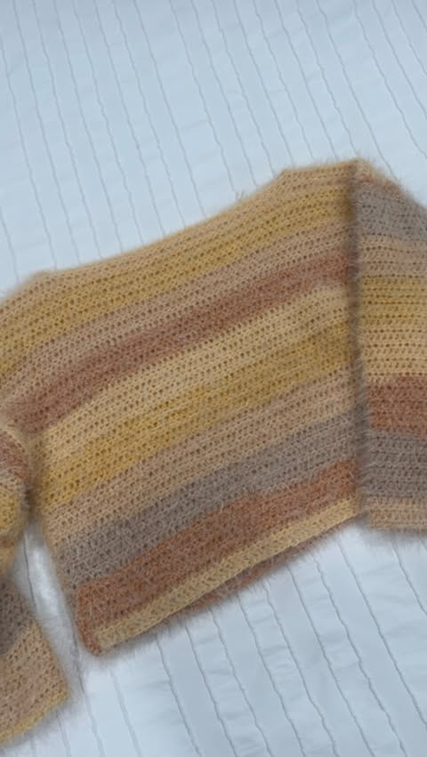 Instagram post by @stitchandflickcrochet for Michaels Stores. Caption reads: this sweater came up so much better than I ever....