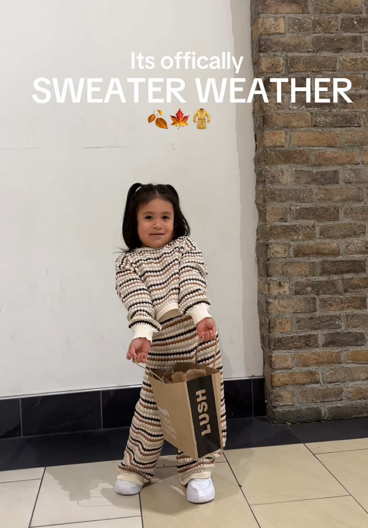 TikTok post by @kokoslifestyle_ for The Mall Luxury Outlets. Caption reads: Sweater Weather is here!🍂🧡 Maizey and I found....