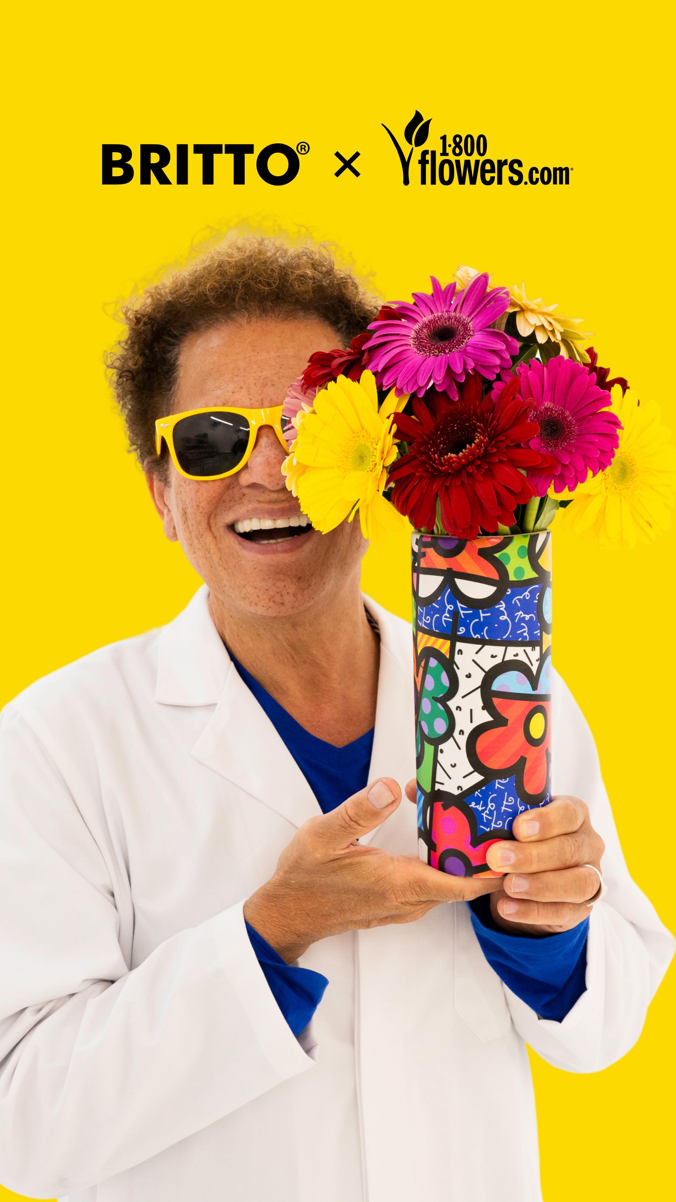 Instagram post by @romerobritto for 1800Flowers. Caption reads: Introducing the Romero Britto x 1-800-Flowers....