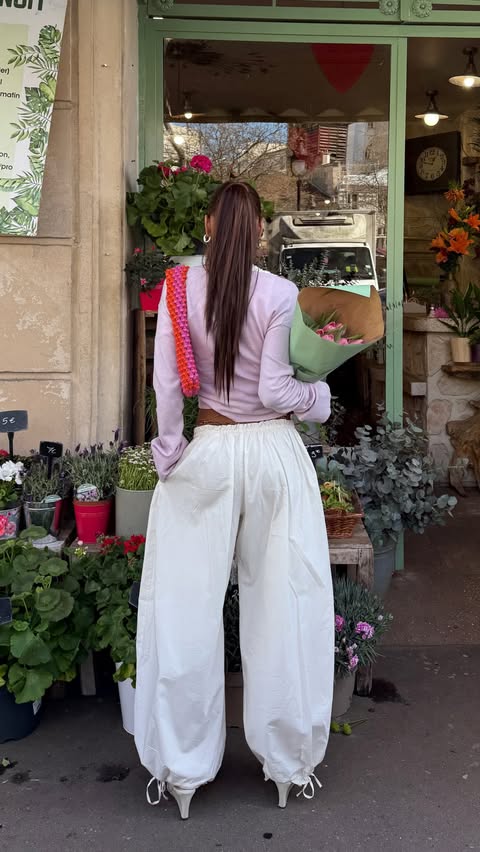 Instagram post by @elisasgn for WEEKDAY. Caption reads: the perfect pair of trouser for my first date with....