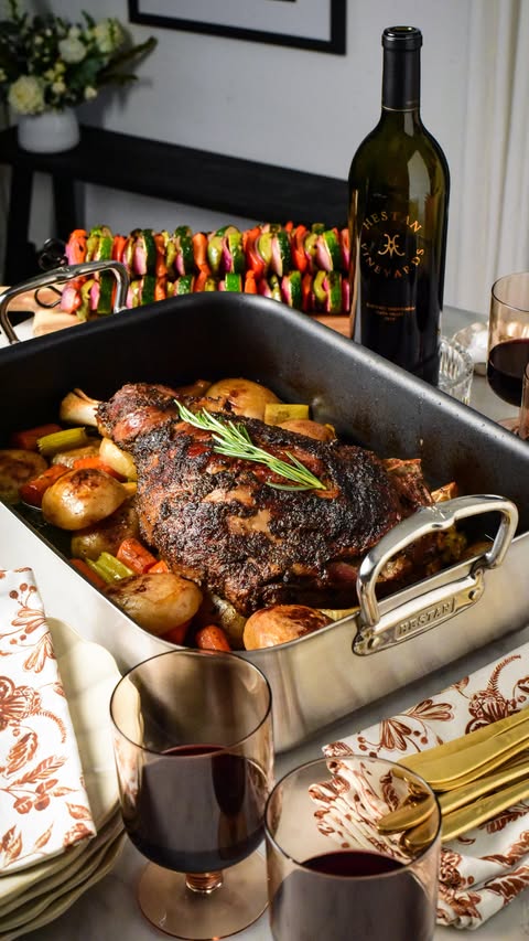 Instagram post by @zimmysnook for Hedley & Bennett. Caption reads: Slow Roasted Greek Lamb Shoulder with Roasting Pan....