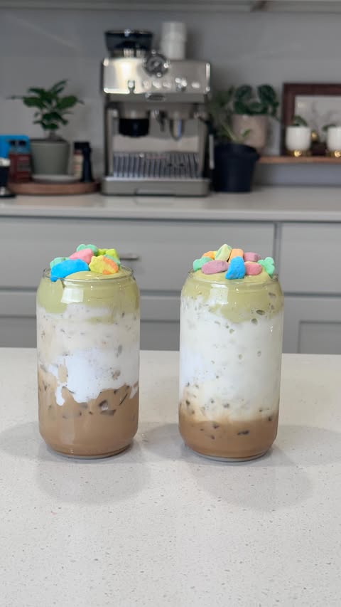 Instagram post by @drinksbywhitney for Tossware. Caption reads: #ad Lucky Charms Latte 🌈🍯🍀 - @tossware POP can....