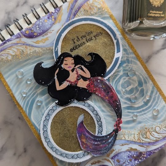 Instagram post by @shelleys.cozy.journal for eStarCase. Caption reads: 'Mermaid' 🧜🏻‍♀️🌊 Journal with me....