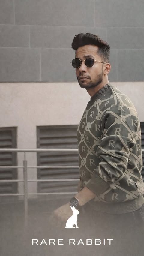 Instagram post by @kanishk_menslifestyle for RARE RABBIT. Caption reads: Walk easy. Look sharp.
.
.
.
#rarerabbit....