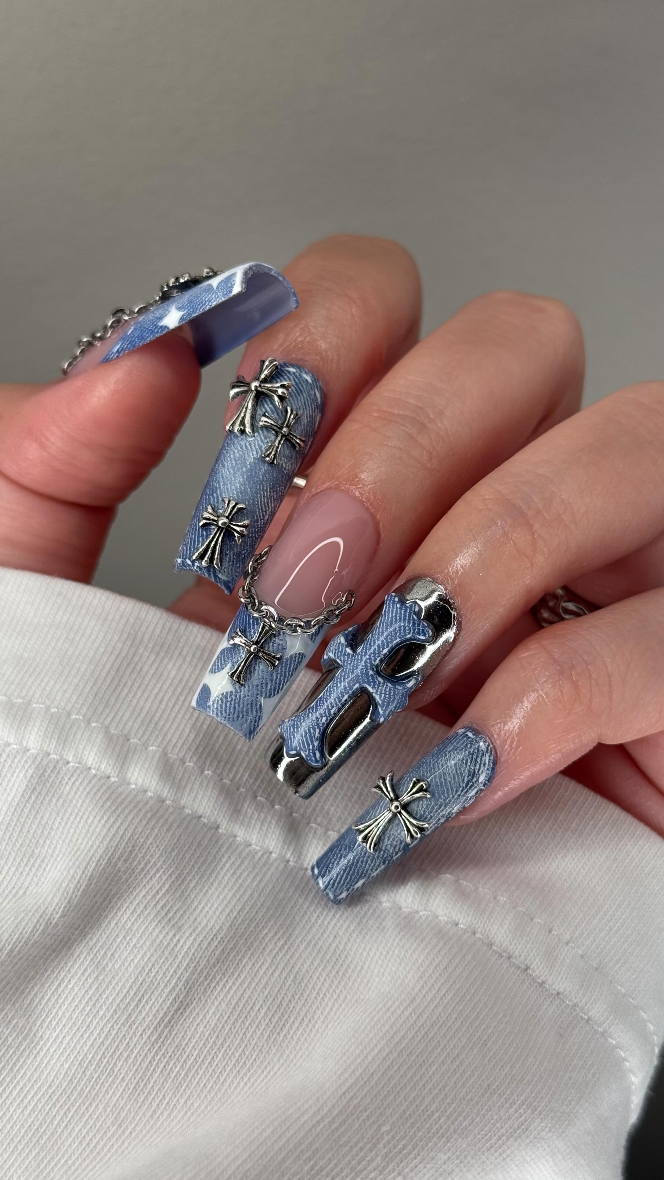 Instagram post by @amys.clients for Chrome Hearts. Caption reads: Mwahaha my turn to do denim nails! 💙 inspired by....