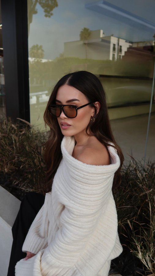 Instagram post by @littleblackboots for Covry. Caption reads: Tokyo on my mind, @shopcovry on my face 🕶️🤍....