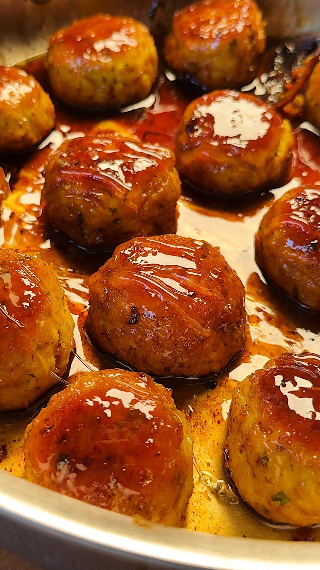 Instagram post by @carolinagelen for NYT Cooking. Caption reads: HONEY LEMON CHICKEN MEATBALLS — now free to access....