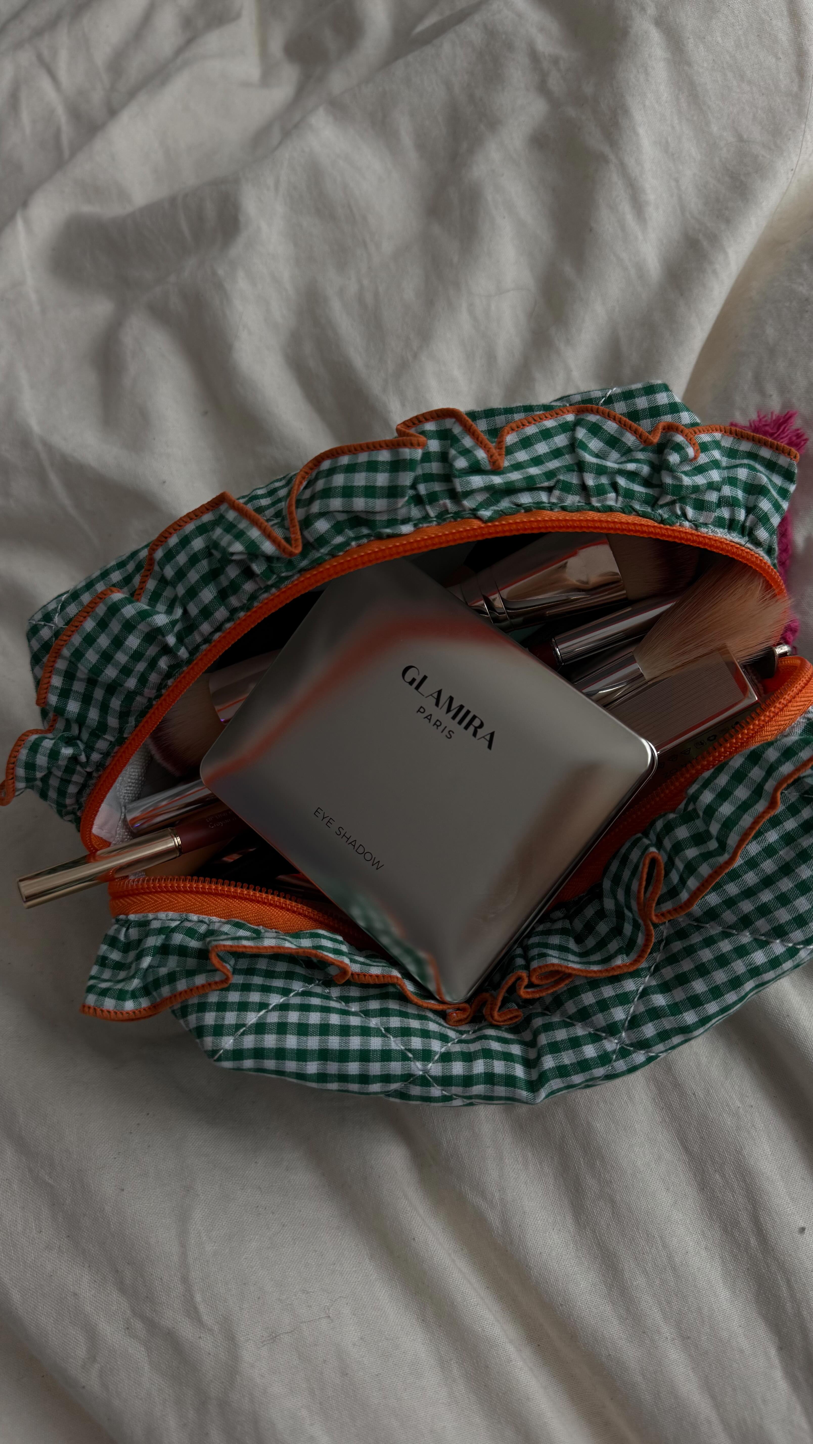 Instagram post by @ayamujahidd for GLAMIRA. Caption reads: Magic Foundation @glamira |AD|
Eyeshadow @glamira....