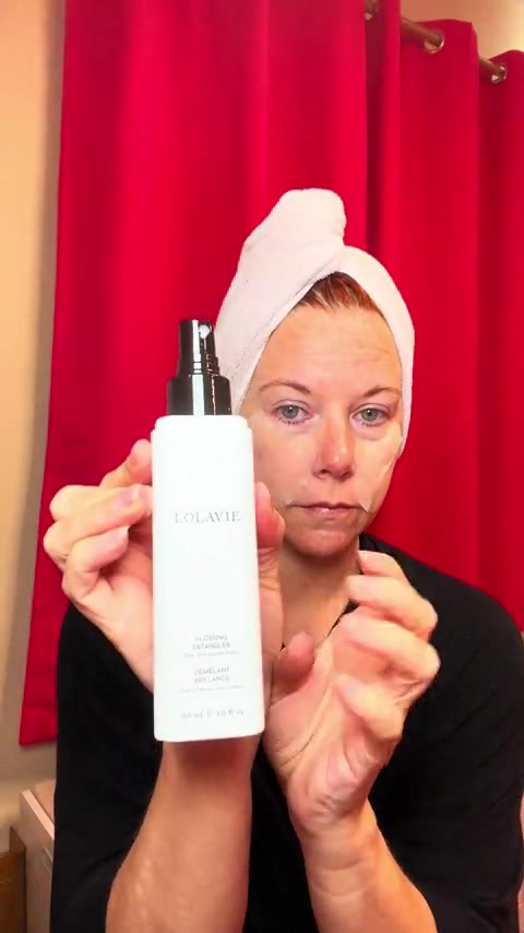 TikTok post by @carebear_chronicles for LolaVie. Caption reads: @LolaVie glossing Detangler by Jennifer Aniston....
