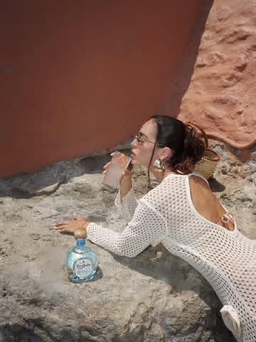 Instagram post by @konstantinasoultati for Don Julio. Caption reads: #ad Exactly how July should feel ✨ summer vibes....