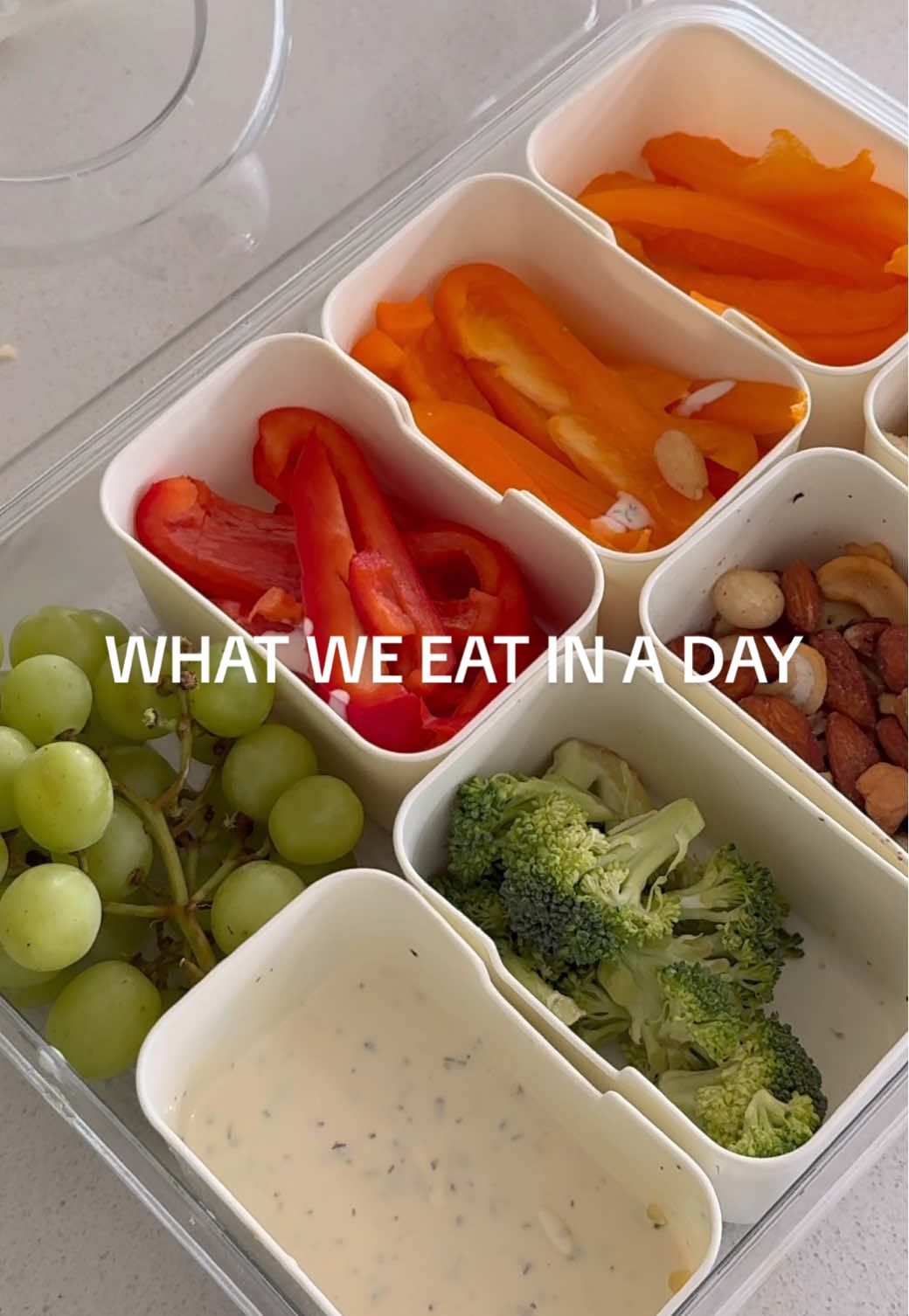 TikTok post by @hay_hess for SmartyPants Vitamins. Caption reads: Snackle box is honestly a life hack🥦🥬🥕🍇 also....