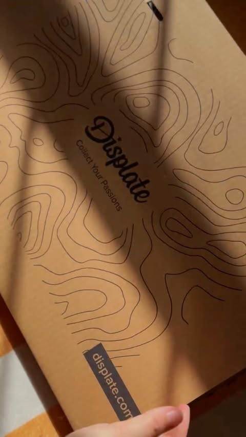 Instagram post by @cozybaggins for Displate. Caption reads: [...] up, I’m super excited to share that....