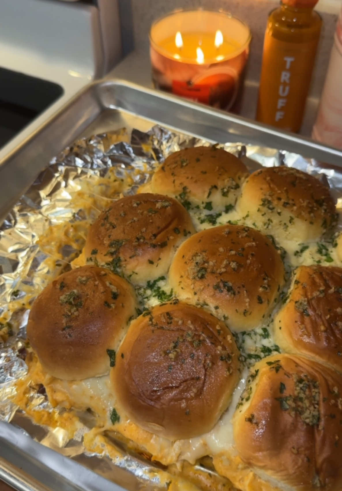 TikTok post by @cookinwithmegg for Truff. Caption reads: The best buffalo chicken sliders 🤤 using @TRUFF....