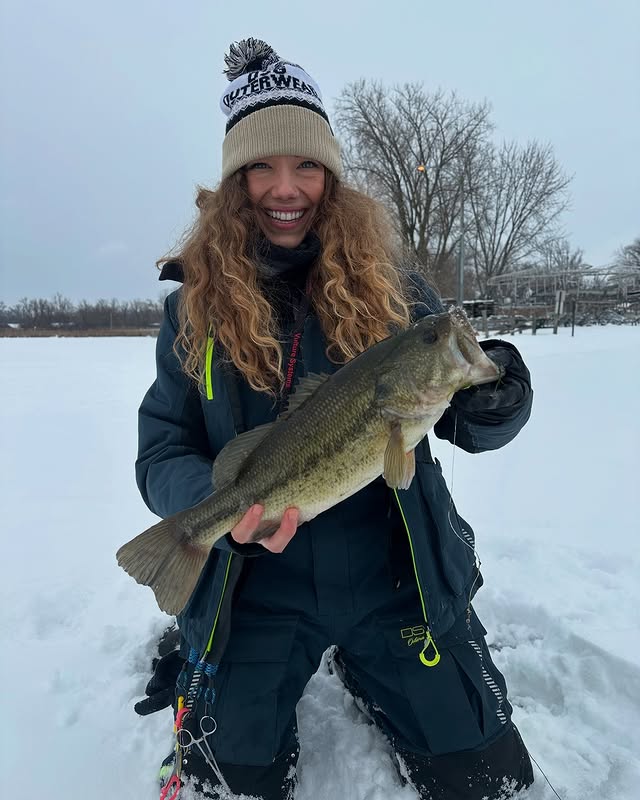 Instagram post by @misskrys_wilderness for DSG Outerwear. Caption reads: Caught this beauty of a bass last weekend! She....